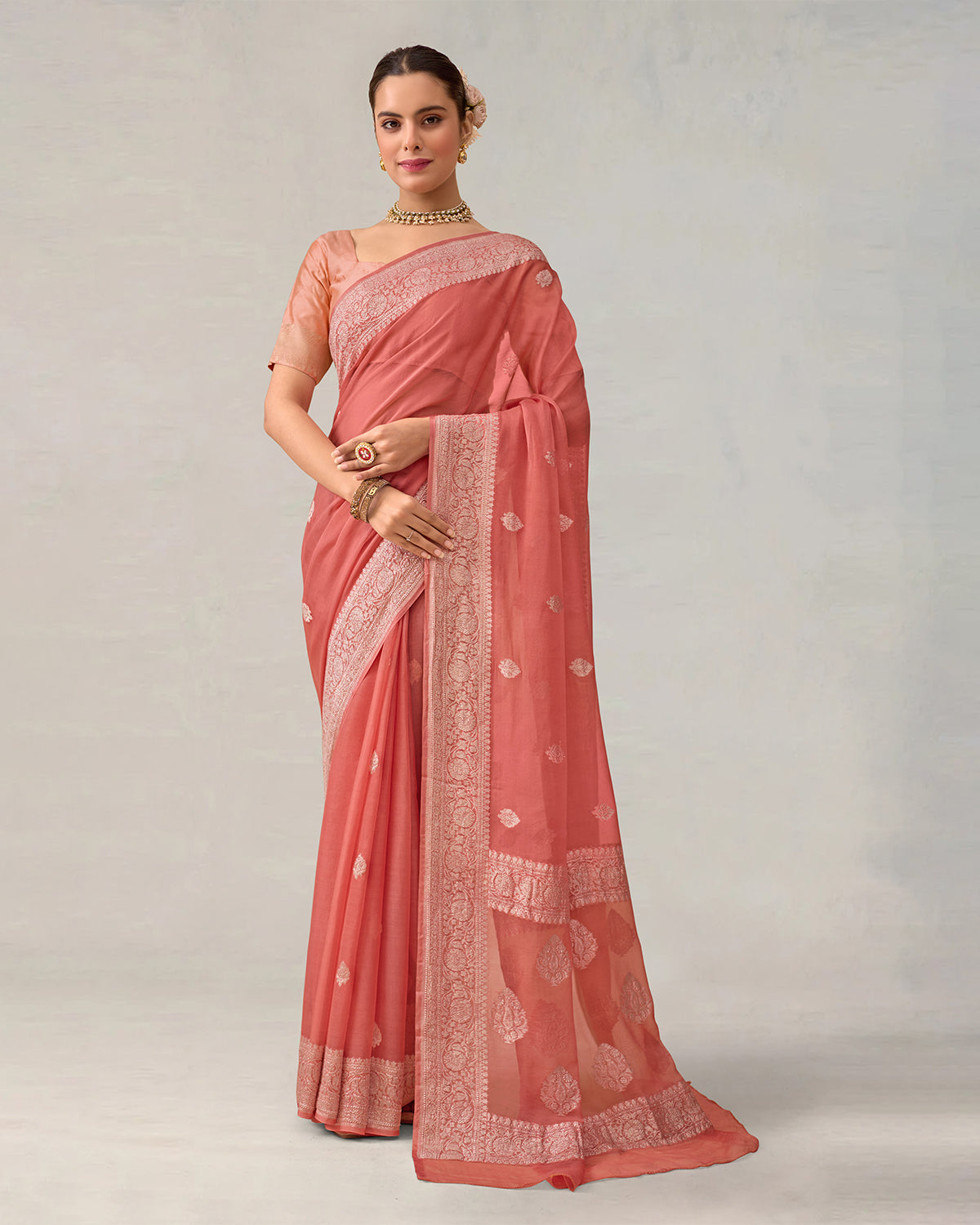 Ethereal Peach-Coral Pure Chiffon Saree with Timeless ' Kadhuwa' Weaving Buti