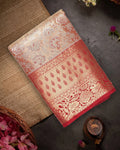 Soft Peach Kanjivaram Silk Saree with Floral Weaving and Paisley Accents